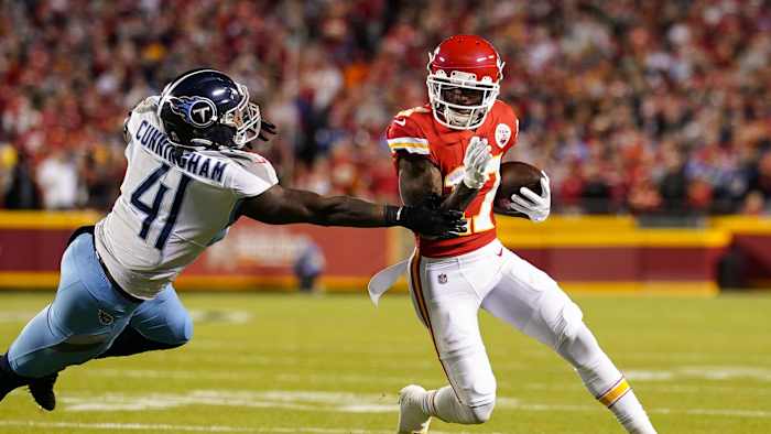 Nov 6, 2022; Kansas City, Missouri, USA; Kansas City Chiefs wide receiver Mecole Hardman (17) runs the ball against Tennessee Titans linebacker Zach Cunningham (41) during the first half at GEHA Field at Arrowhead Stadium.